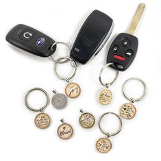 a car keychain with six different types of keys attached to it, including a remote control