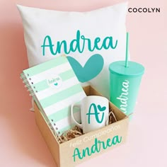 the personalized gift box contains two mugs, a notepad, and a pillow