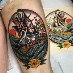 a person with a tattoo on their leg that has an image of a boat in the water