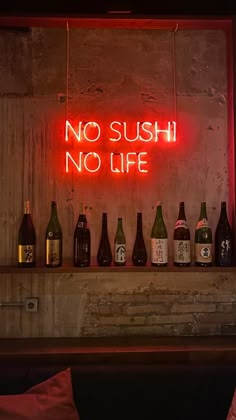 there is a neon sign that says no sushi, no life on the wall