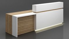 a white reception desk with wooden drawers