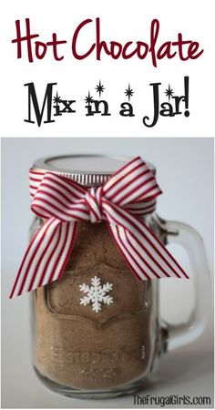 hot chocolate mix in a jar with red and white striped bow on the top, text overlay reads hot chocolate mix in a jar