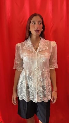 Amazing sheer short-sleeve shirt. Intricately with floral lace embroidery throughout, scallop edging at the Notch collar, sleeves and hemline. Made of sheer tulle with visible shoulder pads and finished with pearl buttons & loop fastening.  Size tag: Medium Classic Sheer Top For Formal Occasions, Feminine Fitted Blouse With Sheer Sleeves, Classic Sheer Tops For Formal Occasions, Elegant Collared Lace Blouse, Summer Lace Collar Top For Daywear, Lace Collar Top For Summer Daywear, Summer Lace Top With Lace Collar, Summer Lace Top With Lace Collar For Daywear, Feminine Summer Blouse With Lace Collar