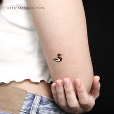 a person with a small tattoo on their arm