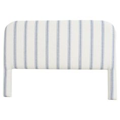 an upholstered headboard with blue and white stripes