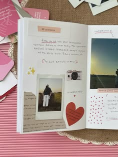 an open scrapbook with photos and hearts on it, sitting on top of a table