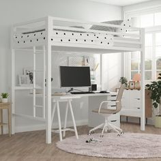 a white loft bed with desk and computer on it in a room that has hardwood floors