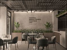 an empty restaurant with tables and chairs in front of a wall that says nothing brings people together