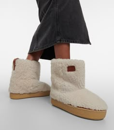 Find ISABEL MARANT ÉTOILE Frieze Shearling Ankle Boots on Editorialist. Upper: leather. Lining: fabric, leather. Sole: fabric insole, rubber sole. Toe shape: round toe. Made in Portugal. Includes: shoe box, dust bag. Designer color name: Ecru. Isabel Marant Etoile, Winter Shoes, Lining Fabric, Shoe Box, Snow Boots, Isabel Marant, Equestrian, Rubber Sole, Color Design