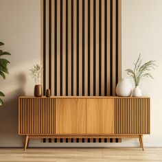 a wooden cabinet with two vases on it in front of a striped wallpaper