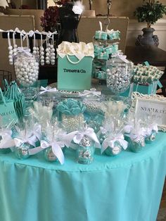 a table topped with lots of blue and white items