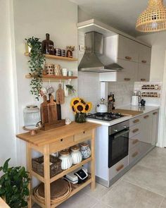 a kitchen with an oven, stove and wooden shelves