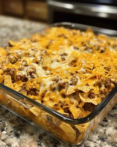 a casserole dish with cheese and ground beef