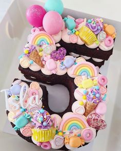 there is a cake in the shape of the number 5 decorated with candy and candies