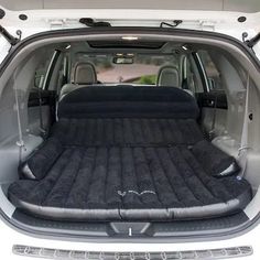 an inflatable car seat is shown in the back of a vehicle with its trunk open