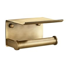 an antique brass toilet paper holder