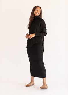 The Soft Knit Ribbed Sweater Skirt is the perfect addition to your modest closet! It features a modest straight fit, a stretchy waist, and no slit. This cozy skirt is crafted from a soft knit fabrication for a true seasonless staple. Just add the matching soft knit turtleneck for an effortless elevated casual look! Style | Maxi Color | Black SIZING TIPS Fit | Fitted Stretch | Stretchy Model | True to Size Cozy Skirt, Knit Skirt Outfit, Sweater Skirt Set, Elevated Casual, Long Skirt Outfits, Black Knit Sweater, Essential Dress, Knit Turtleneck, Fall Skirts