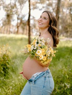 a pregnant woman with flowers in her belly