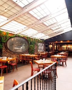 the inside of a restaurant with tables and chairs