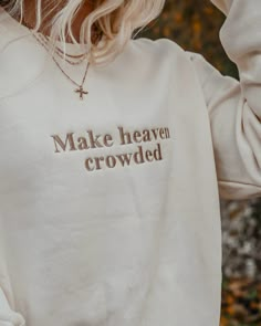 Represent and Share your faith with our Make ﻿﻿heaven crowded crew. These crews have a luxury soft feel that'll keep you warm while also being lightweight. Available in two colors; cream with brown embroidery and black with white embroidery. Model in cream wearing size medium Model in Black wearing size small Minimalist Sweatshirt Design, Cute Cricut Sweatshirt Ideas, Crew Neck Designs, Christian Apparel Aesthetic, Cricut Crew Neck Sweatshirt, Fall Embroidery Designs Sweatshirt, Fall Embroidered Sweatshirts, Embroidery Hoodies