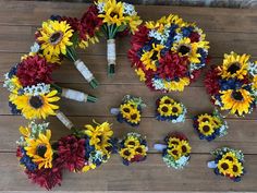 sunflowers and other flowers laid out on a wooden floor