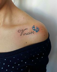 a woman with a tattoo on her shoulder that says finios and an animal paw