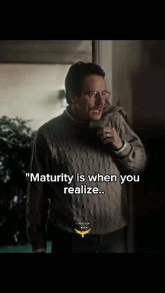 a man standing in front of a window talking on a cell phone with the caption'maturify is when you realize