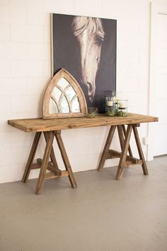 Saw Horse Base Console Table, The Feathered Farmhouse Saw Horse Table, Horse Base, Horse Table, Bamboo Lighting, Country Style Furniture, Saw Horse, Rustic Meets Modern, Wooden Console Table, Rustic Mirrors