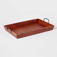 a wooden tray with black handles on a white background