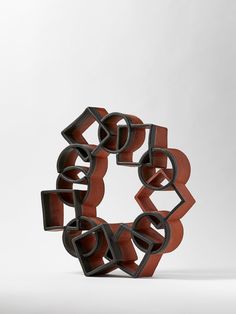 an abstract sculpture made out of wood and metal