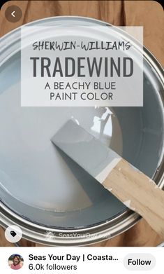 a paint can with the words shewn williams tradewind on it and a wooden spatula