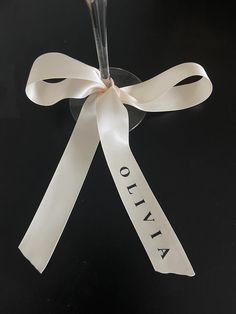 a white ribbon with the word otna written on it