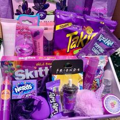 a purple basket filled with lots of different items