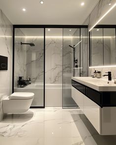 a modern bathroom with marble floors and walls