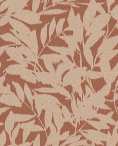 an orange and white leafy pattern on fabric