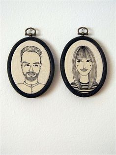 two hand embroidered portraits of people are hanging on the wall in front of a white wall