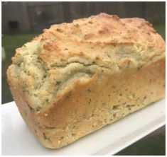 a loaf of bread sitting on top of a white plate