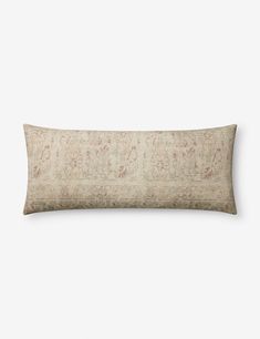 a rectangular pillow with an embroidered design on the front and back, in neutral tones