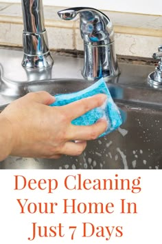 a person cleaning a sink with a rag