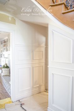 the interior of a house being painted white