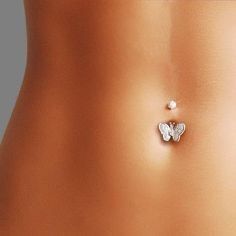 an image of a woman's stomach with a butterfly pin in the middle of it