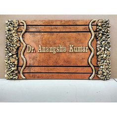 a plaque that reads dr amesha kunnar