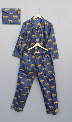 ITEM DESCRIPTION: 100% Pure cotton hand block printed night suit, perfect for summer while sipping tea on your terrace ! This pajama is made for a relaxed fit and allows for ease of movement throughout the night. Every piece can be made customized to your desires. Size type : Regular Material : 100 % Cotton fabric Garment Care : Wash care Package Includes : 1 Set of Sleepwear ( 1 Pc Top + 1 Pc Pants And matching Pouch ) Color :- Base Color Is Multicolored Floral Prints Have been Crafted. Usage : Party Pajamas, Bridal Party Pajamas, Summer Pjs, Bridesmaid Pajamas, Cotton Pajama Set, Pyjama Sets, Women Pajamas, Cotton Pajamas, Cozy Pajamas