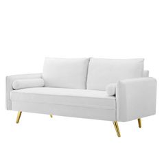 a white couch with two pillows on it