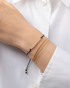 Choose your color, choose your fortune - the 14k gold bead row fortune bracelet is here to bring you good vibes! Each color has its own meaning, so why not mix and match? This cute and versatile bracelet is a must-have for your everyday looks! Adjustable length to fit most wrists: 6.5"- 8" Cord: Nylon Standard Production: 4-7 business days Rush Order Production: 2-5 business days Shipping: Select shipping method at checkout. Shipped from our L.A. Studio. This item is Final Sale. See here for det Red Baby, Personalized Necklace, Gold Beads, Ring Bracelet, Mix And Match, Gold Black, Black And Navy, Everyday Look, Good Vibes