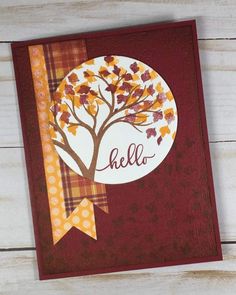 a card with an autumn tree on it