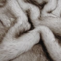 an animal fur texture is shown in grey and white