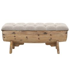 a bench made out of wood with a cushion on the top and legs, sitting in front of a white background