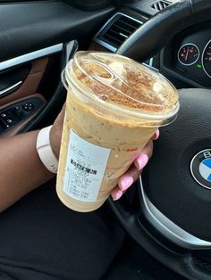 Close-up of a hand holding a Dunkin’ Cookie Butter Cold Brew with the car dashboard in the background. Cookie Butter Dunkin Drink, Dunkin Orders Iced Coffee, Cookie Butter Cold Brew, Dunkin Aesthetic, Starbucks Drinks Recipes, Coffee Games, Cookie Butter, Fall Drinks