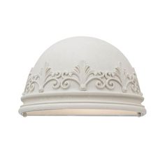 a white ceiling light with an ornate design on the top and bottom part of it